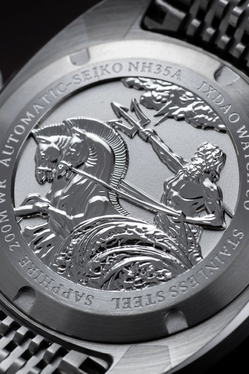 Close-up of the back case of a stainless steel watch, featuring an engraved mythological scene with a horse-headed figure and a woman holding a trident, with text reading 'AUTOMATIC-SEIKO NH35A' and 'STAINLESS STEEL'.